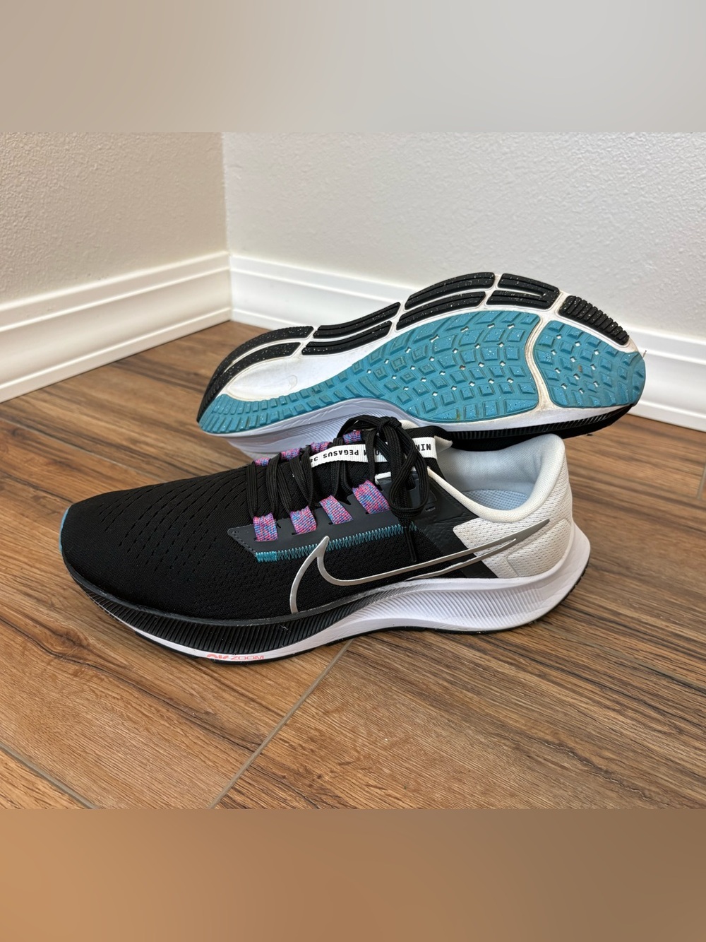 Nike Women’s Black Running Shoes with Teal Outsole and Silver Swoosh